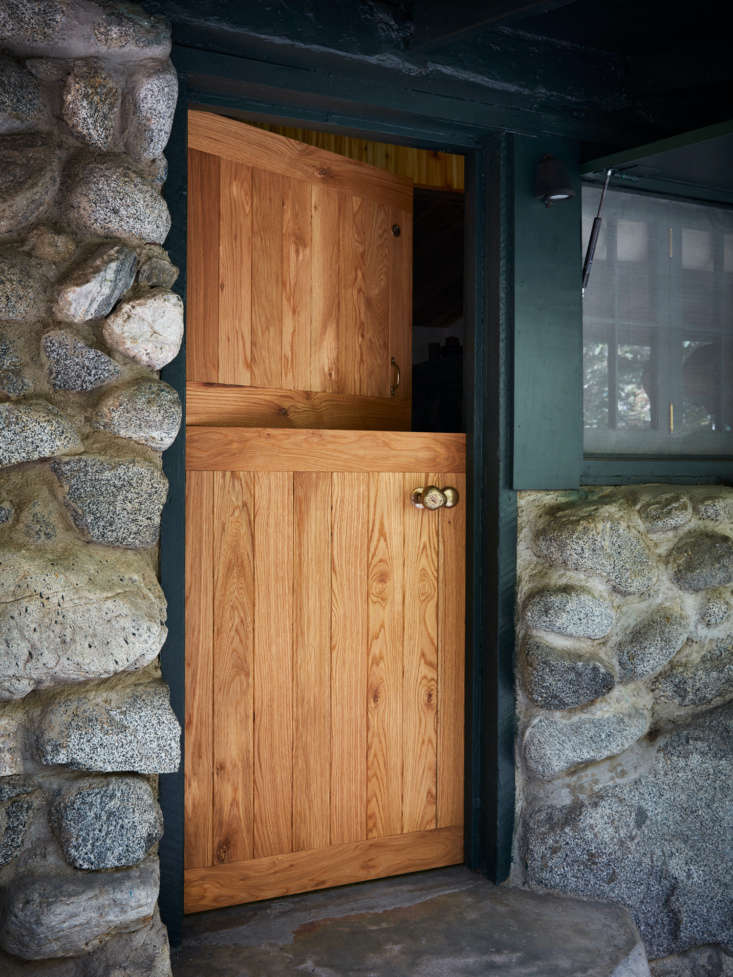 A Hollywood Directors Refined OfftheGrid Cabin by Commune Design &#8220;The solid white oak Dutch door is new, and we worked with Van Cronenberg Hardware to make a custom bronze doorknob that is a direct cast of a rock taken from the stream in front of the cabin,&#8221; says Johanknecht.