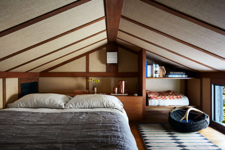 a ladder from the kitchen leads to a sleep loft, which features a ceiling cover 15