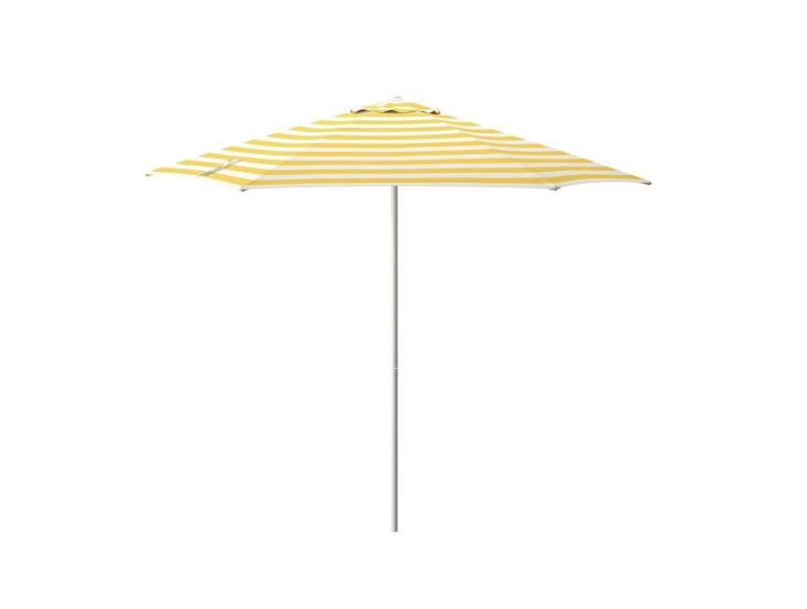 Channel a French Riviera beach resort with this chic striped sun umbrella. (Base sold separately.) Shop now.