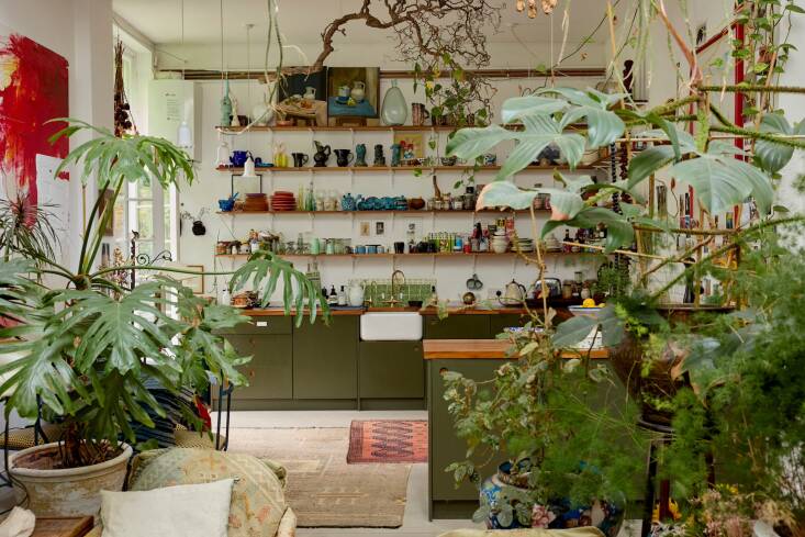 The view from the jungle-like sitting area to the kitchen.