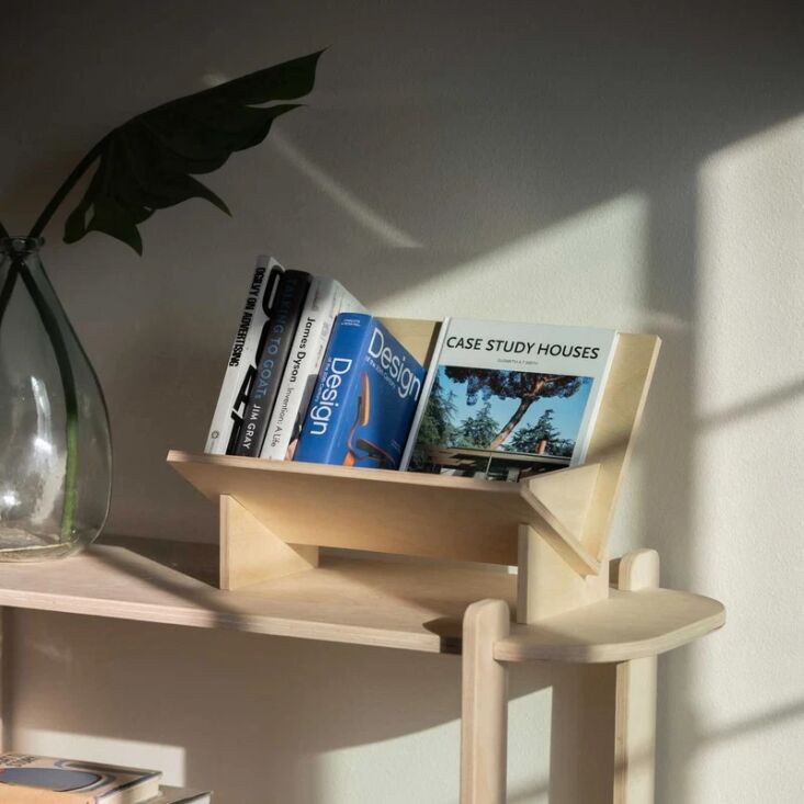 Unfnshed\2\17;s Record/Book Holder is a stylish way to both store and display. See The Editors’ Cut: Home Office Upgrades for Smoother, Stress-Free Workdays for more ideas.