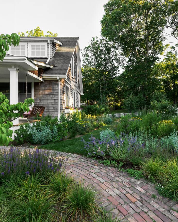 The handy homeowner had built beautiful fences and pathways, but most of the yard was just lawn. Now lawn is used only for pathways and everything else is meadow or garden.
