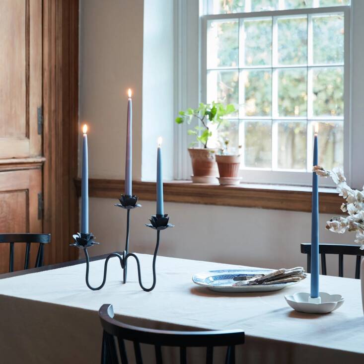 Enjoy \20 percent off all products designed by The Floral Society, with code GARDENISTA\20, through October 30. Pictured: the wrought-iron Rana Candelabra, Original Dipped Taper Candles, and the ceramic Fleur Taper Holder.