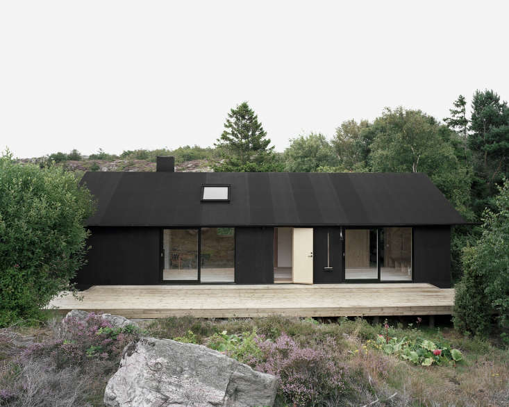 Plywood painted with pine tar clads the exterior of this cottage in Sweden by architect Johannes Norlander. Photograph by Rasmus Norlander, courtesy of Johannes Norlander Arkitektur, from Architect Visit: Johannes Norlander in Sweden.