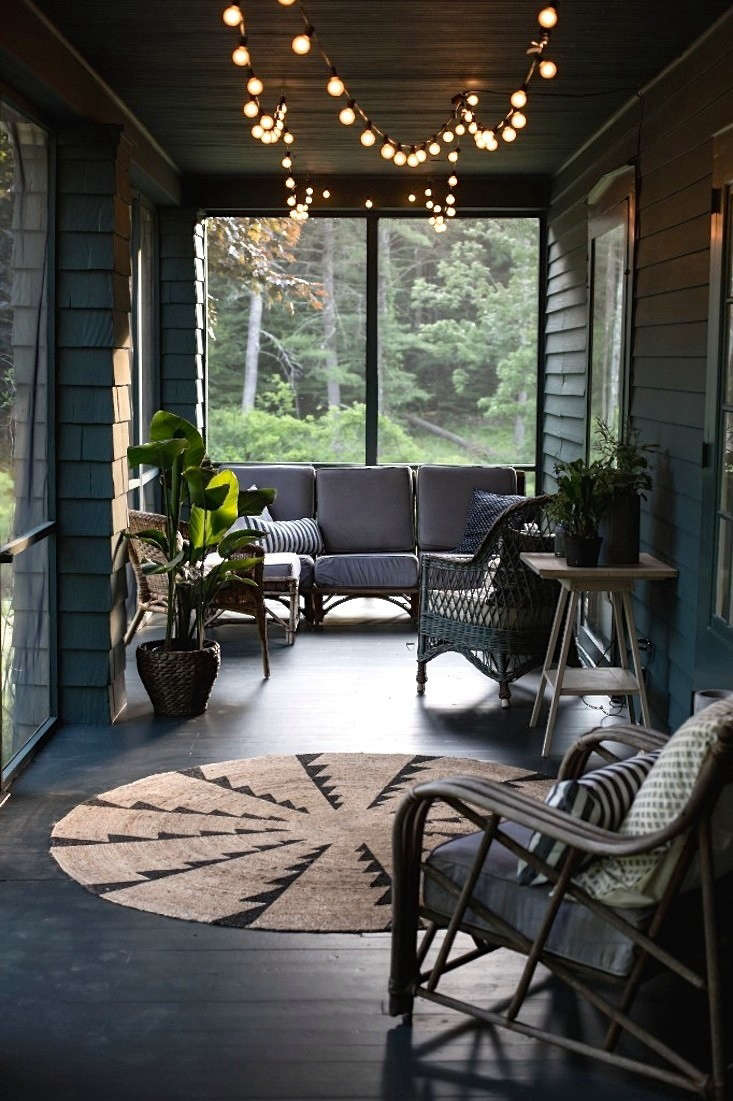  Design team Tara Mangini and Percy Bright of Jersey Ice Cream Co. rescued a nondescript and unloved screened porch in the Catskills–and made it magical. Photograph courtesy of Jersey Ice Cream Co., from Before & After: A Summer Porch Rehab in Upstate New York.
