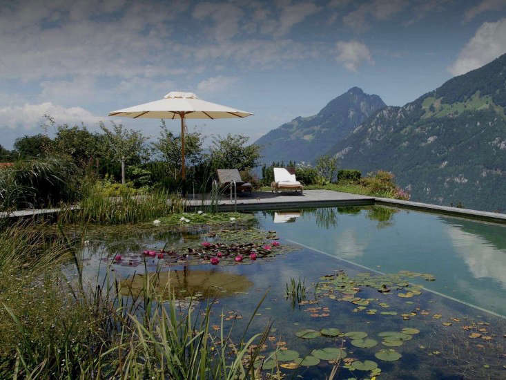 In Switzerland near Lake Lucerne, a natural swimming pool supported by a retaining wall on a steep slope &#8220;appears to almost float weightlessly out over the valley,&#8221; the designers say. Photograph courtesy of Biotop.