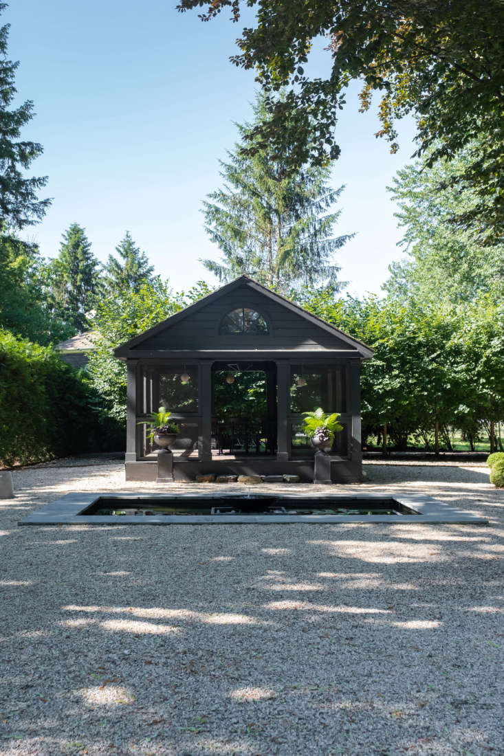 Beyond the hedges lies the garden&#8\2\17;s piece de resistance: a long, formal gravel garden, centered by a screened outbuilding (for long, warm-weather dinners) and a shallow reflecting pool.