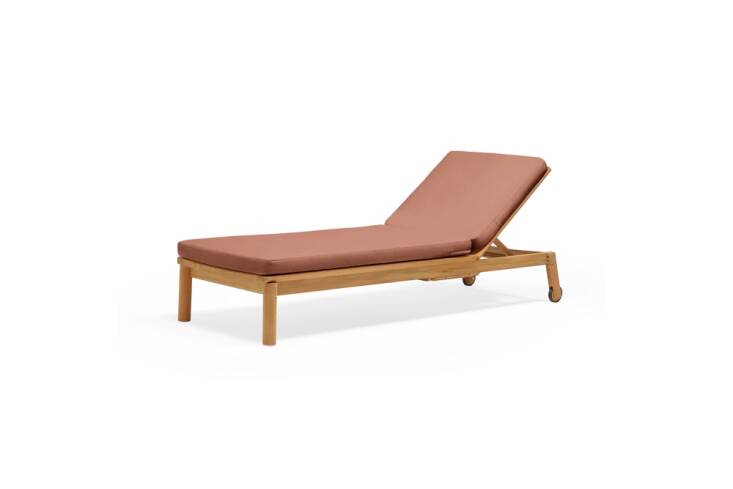 The Haven Sun Lounger has a retractable side table and cushions made of quick-drying reticulated foam and recycled Sunbrella fabric. Available in eight colors (pictured in Heritage Rust), it