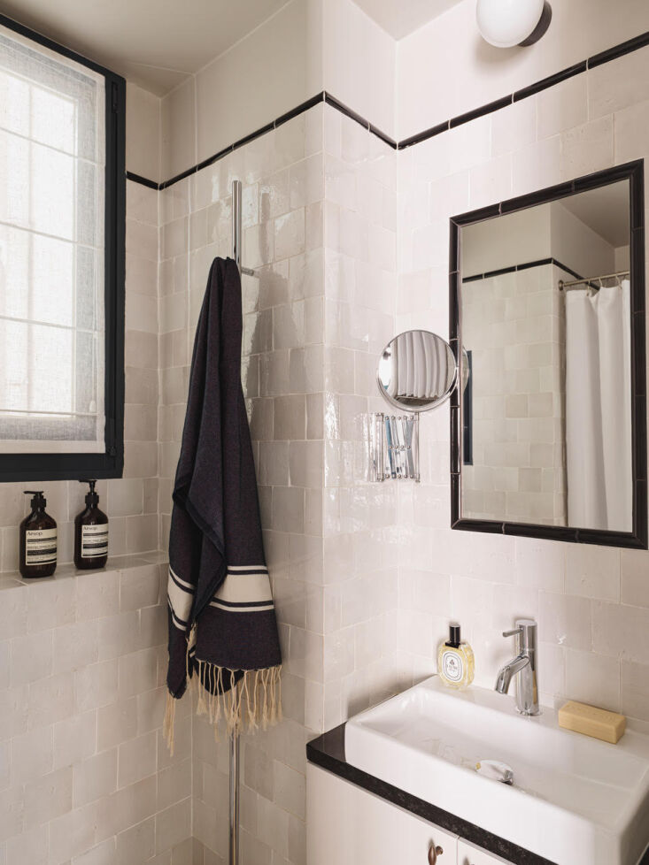 When you remodel an extra-tiny space, like this micro bathroom, you can splurge on the materials. Photograph by Stephan Julliard, courtesy of Marianne Evennou, from \269 Square Feet in Paris: Design Ideas from a Shoebox Apartment Reinvented By Marianne Evennou.