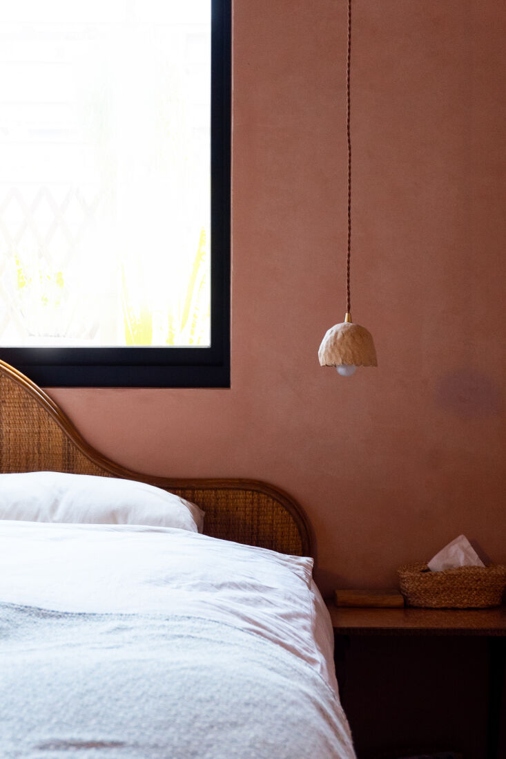 A petite handmade ceramic light adds poetry to this bedroom in Taiwan&#8\2\17;s capital. Photograph courtesy of Homework Design, from An Apartment in Taipei: A Childhood Home, Updated for a Newlywed Couple.