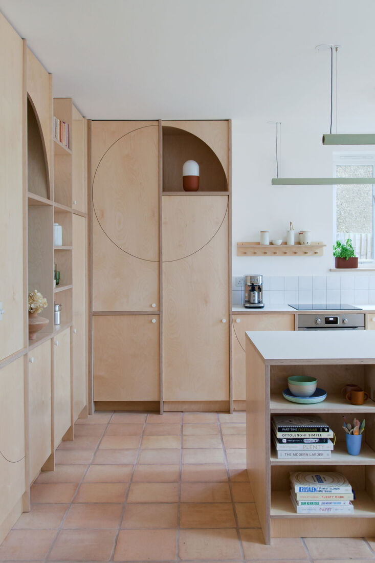 Birch plywood was chosen for the custom cabinets in this bright modern kitchen because it&#8\2\17;s cost-efficient. Photography by Megan Taylor, courtesy of Nimtim Architects, from Kitchen of the Week: Playfulness and Plywood in a London Kitchen by Nimtim Architects.