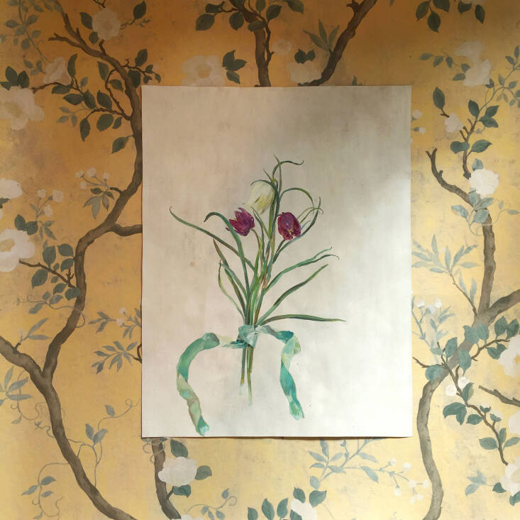 Wallpaper often pairs well with art: Camellia in Golden Yellow is layered with one of Flora&#8\2\17;s paintings.
