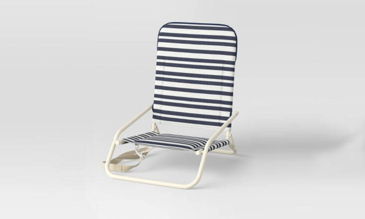 And a budget option: The weather-resistant Threshold Portable Sand Chair from Target comes in three patterns, but this navy stripe is by far the most classic; each is \$45.