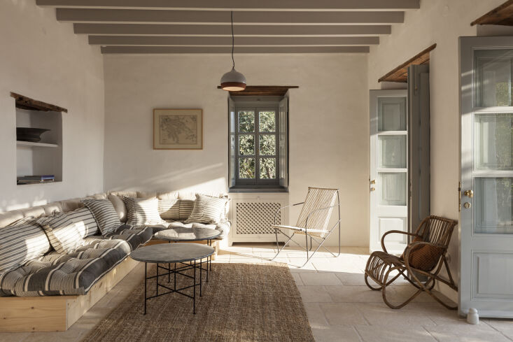 Not quite ready for cooler weather yet? This house in Greece strikes a balance between easy-breezy and cozy comfort. Photograph courtesy of Studio Krokalia, from Color and Quiet: An \1700s House in Patmos, Greece, Restored by Studio Krokalia.