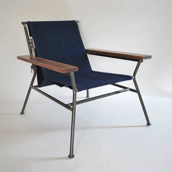 Navy seat with a natural steel base.