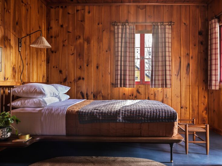 A rustic cabin bedroom. Photograph by Chris Mottalini, courtesy of Camptown, from Camptown: The New High-Style Cabin Retreat in the Catskills.