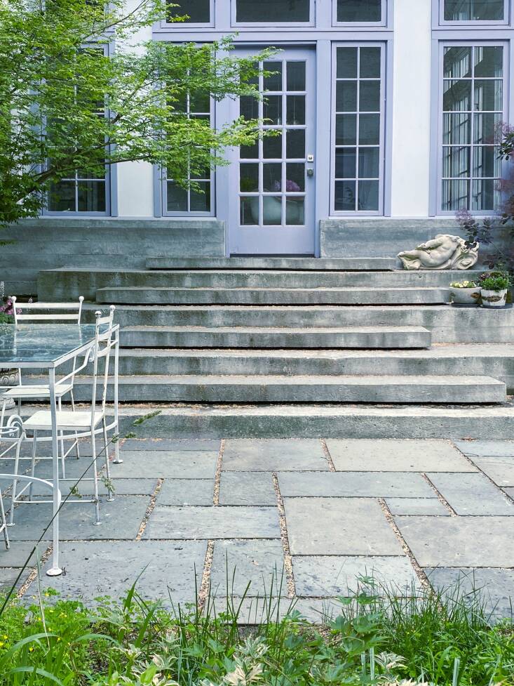 The new floating steps, designed by Jim and executed by concrete contractor Ben Keyser, that lead from the dining room to the patio. \2\20;Ben fabricated the concrete steps, and encased the dining room below the windows with concrete. The poured stairs were a feat of engineering,\2\2\1; marvels Amy. \2\20;Jim always wanted to have poetry readings in the backyard with the steps as seating. We now have one planned for the first time in September with poet Sara Berkeley.\2\2\1;