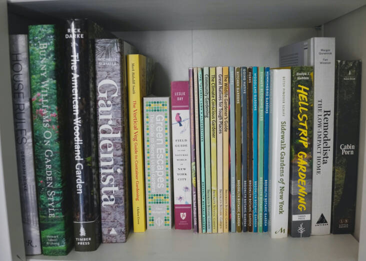 My collection of BBG gardening guides on the bookshelf.