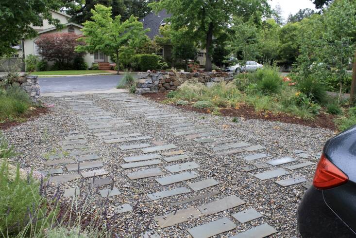 For this driveway design, ledgestones were placed where the tires meet the ground. Photograph courtesy of Mariposa Gardening & Design.