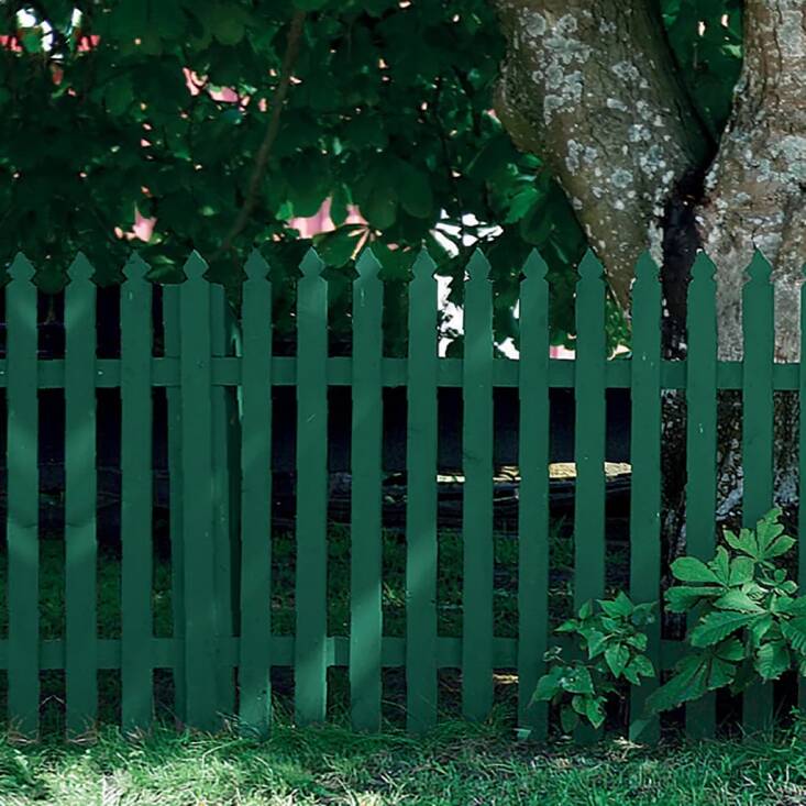 Green pine tar painted on a fence. Photograph via Auson, a Swedish brand of traditional pine tar finishes carried by both Sage Restoration and Earth & Flax.