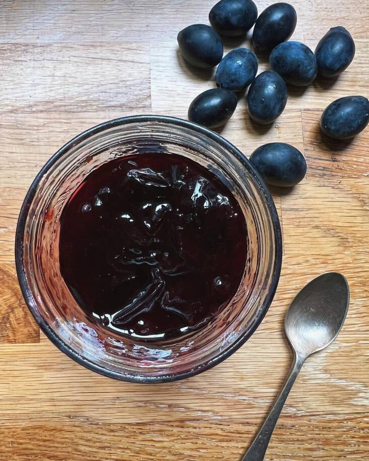 Claire&#8\2\17;s homemade damson jam. She writes about the fruit in Unearthed: “So dark an indigo that it is almost black, with rich yellow flesh that clings tightly to its stone, it’s a fruit that asks you to work for the privilege of its flavour, as they are bitter and unkind to eat raw. You have to cook them before they give themselves up to you, and it might be that this effort is part of why I cherish them as I do.” Photograph via @claireratinon.