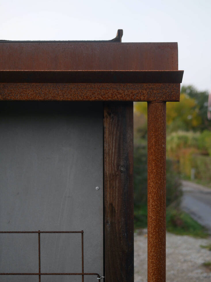 From the project description: &#8220;The corten steel details are welded together with standard flat and U-shaped profiles, with the resulting kinks and overhangs leading the water out over the wood and into the gutter, and finally down the cylindrical downpipe.&#8221;