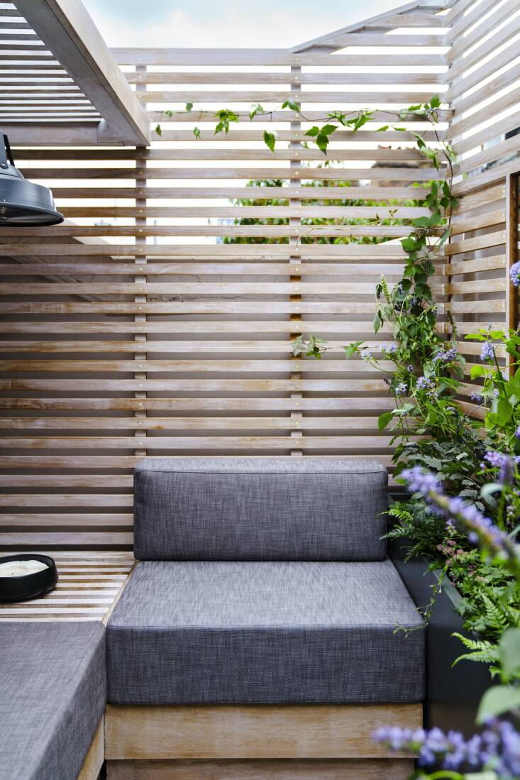 Everything, from the plant design to the custom built-ins, was designed by Lis. A pergola offers ample shade, as promised. &#8220;I also added a heater hanging from the pergola so that he can comfortably enjoy the space in the colder months,&#8221; she shares. 