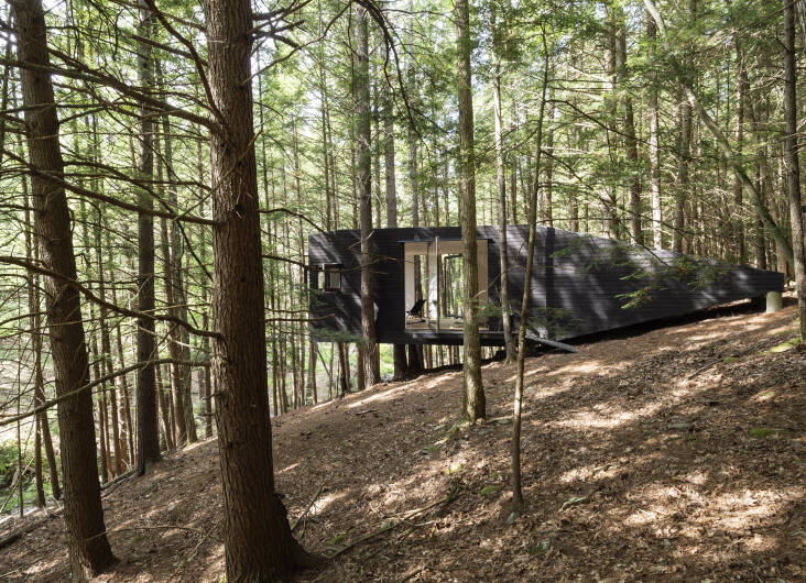 The owners of this off-the-grid retreat learned how to apply pine tar by watching YouTube videos. Photograph by Matthew Williams, from Remodelista: The Low-Impact Home.