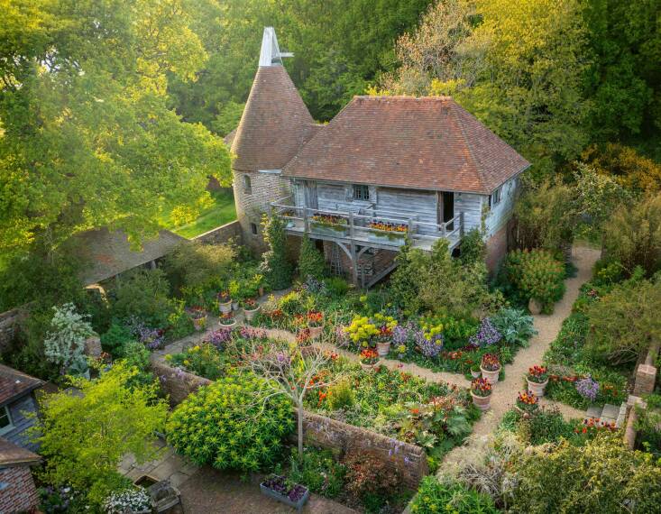 An overhead view of the Oast Garden, teeming with potted plants, at Perch Hill in spring.