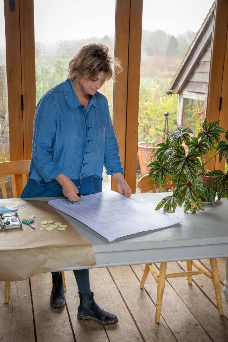 Raven planning her garden with pencil and paper.