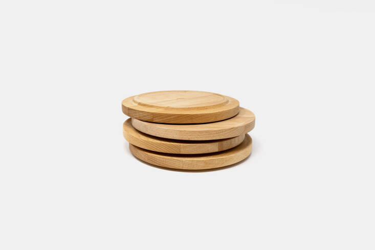 The Alessi Tonale Plate in beech wood is functional for outdoor dining; €35 each at Volta.