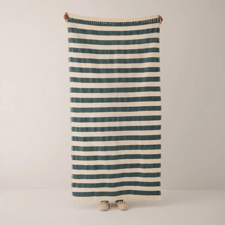 Perfect for picnicking in the garden, the Omo Beach Towel, made from hand-spun cotton, is \$90 at Goodee.