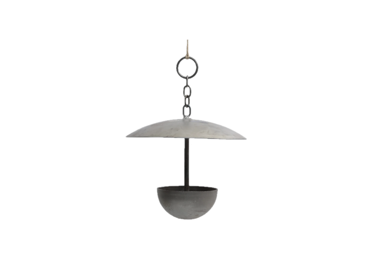 This handmade English Metal Hanging Bird Feeder will slowly develop patina when exposed to the elements; it\2\17;s \$88 at Gardenheir.