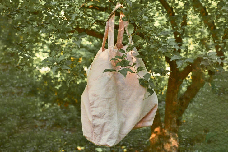 The Salter House Linen Shopping Bag, shown in a soft blush Misty Rose color, are made by a zero-waste company using traditional flax linen; \$45 at Salter House.