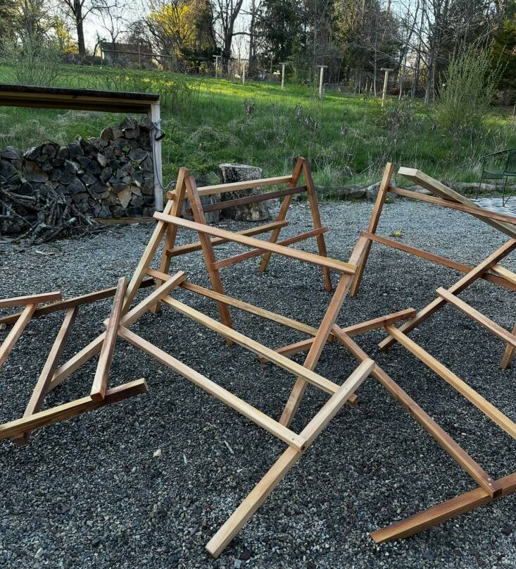 My initial batch of crossbar “ladders” drying after oil. I used cedar \2x\2s. I prefer cedar because I love spending an arm and a leg on garden projects. No really, I picked cedar because of its durability outdoors and because it matches our home and garden décor generally.