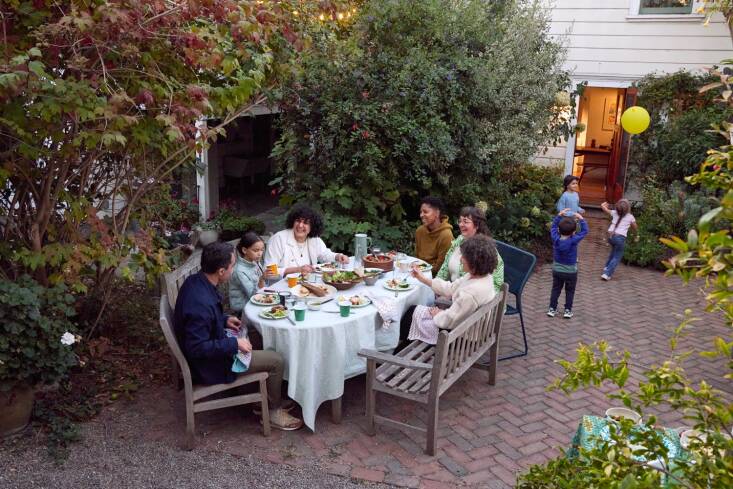 The courtyard is where the neighbors come together for shared meals.