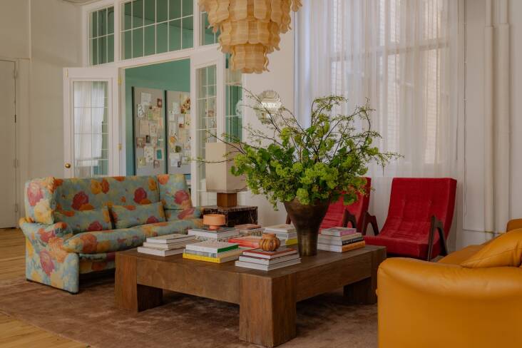 Kelsie brainstormed the House of Three plans with her husband, Justin Fine, a consultant for tech consumer businesses, whose input led to the living area: \2\20;Justin loves a conversation pit.\2\2\1; The floral Cassina sofa, a vintage Italian design from Mid-Century LA, sets the tone; it was the first piece Kelsie bought for the space.