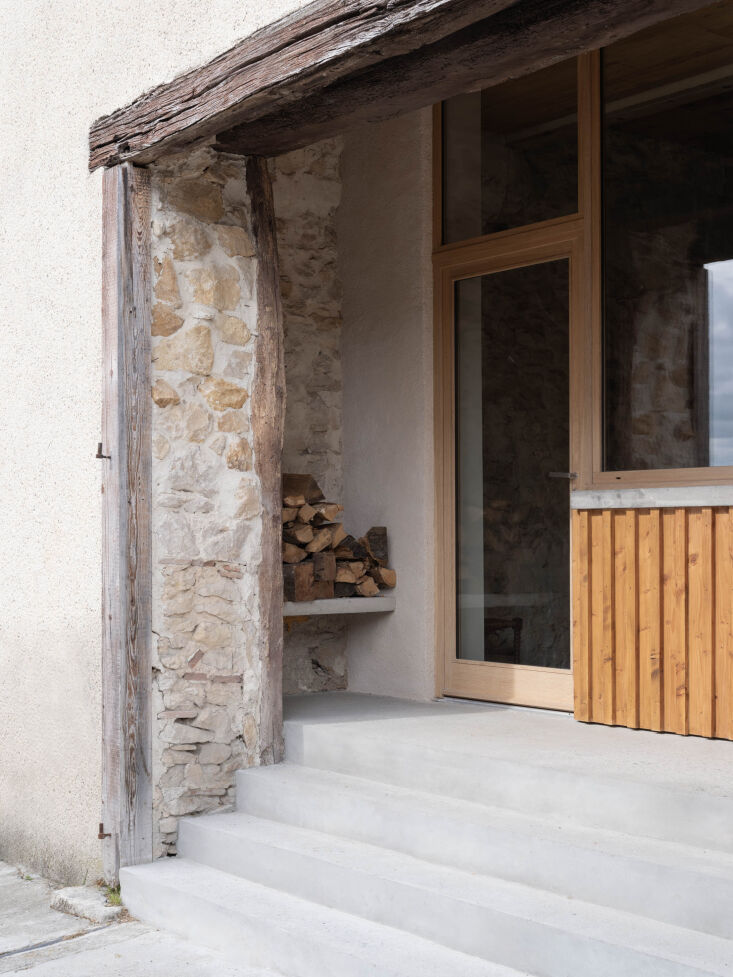 We love the idea of a built-in nook next to the front door, with bench for seating or firewood storage. Photograph by Sandrine Iratcabal for Les Ateliers Permanents, from Rehabilitating, Adapting, Transforming: A Medieval House in Aurignac, France.
