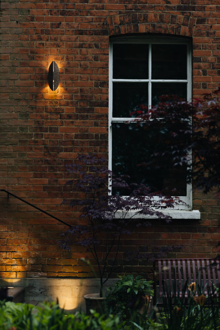 The cast aluminum Warrior Wall Light, in an antique copper finish, is by Franklite.