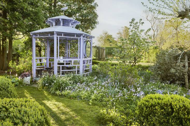 When asked about the purple paint on Madoo’s iconic gazebo, Dash would quote Manet, who once said, “The very color of the atmosphere is violet.” Spanish bluebells (Hyacinthoides hispanica) carpet the ground outside the gazebo.