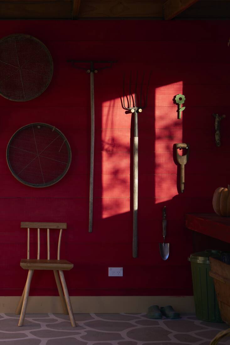 Now there is a place for everything, including the round sifters Hadley uses to filter out large woody pieces from her compost (she scored the vintage sifters at an auction). There\2\17;s even a place for art, like the ceramic Wall Flower made by Leanne. The chair is by Greg Quinn.