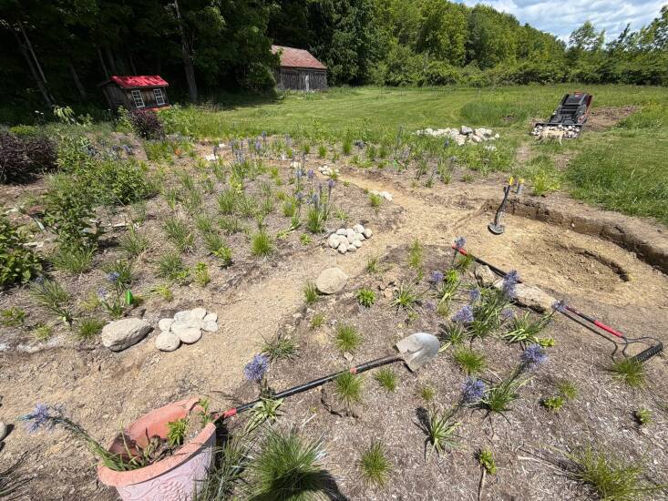 The dry beds and frog pond in progress.