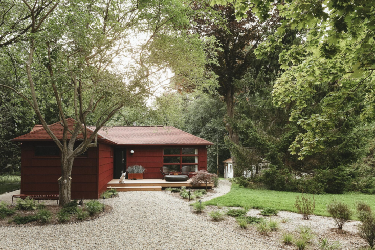 \2\20;We replaced the brown roof and gutters with red shingles and rose-colored gutters\2\2\1; for all-red everything. \2\20;It’s a modern look on a mid-century home that feels clean and welcoming.\2\2\1; A new organic-shaped driveway lined with river rocks softens the clean lines of the home.