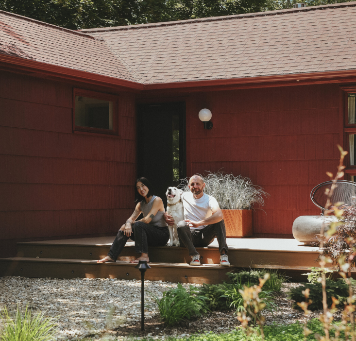 Kim and Scott with their dog. The pair replaced the original small octagonal window (\2\20;not a fan\2\2\1;) next to the front door with a window from the back of the house.