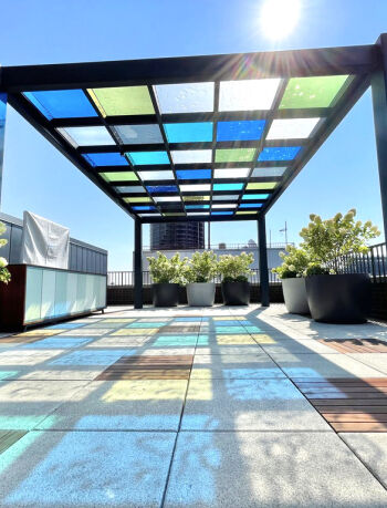 soho terrace design custom pavers colorful pergola multi colored